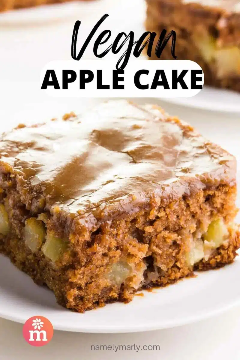 A slice of cake has caramel frosting on top. The text reads, Vegan Apple Cake.